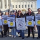 SPL supporters holding signs at the Dobbs rally outside the Supreme Court