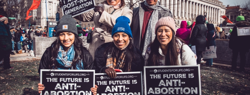 Young people with pro-life signs
