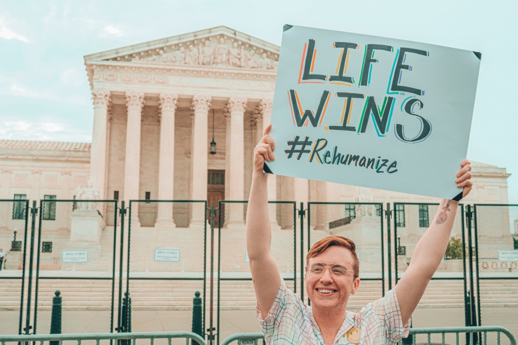 Pro-life advocate Herb Geraghty holds a "Life Wins" sign outside the Supreme Court building