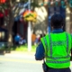 A security guard on a sunny street