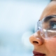 A researcher wearing protective glasses