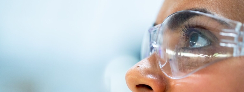 A researcher wearing protective glasses