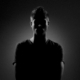 An anonymous male silhouette