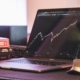 Laptop displaying stock market graph