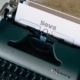 Typewriter printing the word "News"
