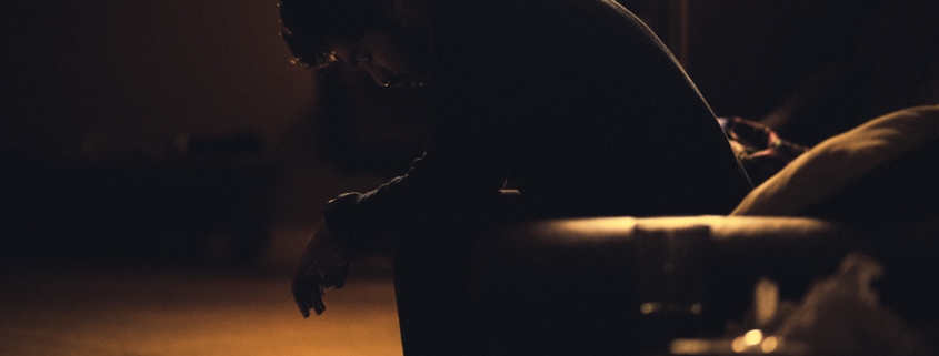 A depressed person in the shadows. Photo credit: Gadiel Lazcano on Unsplash
